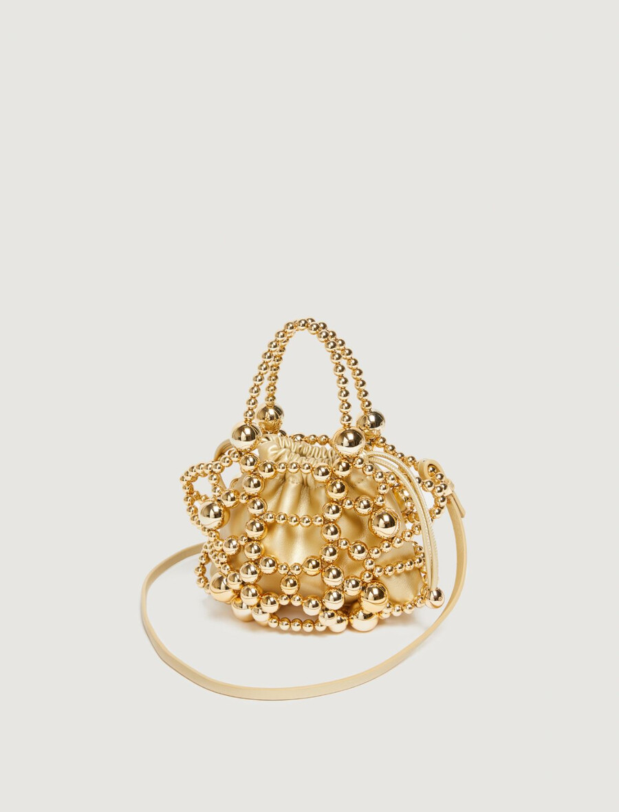kleine beuteltasche mit kugeldetail – gold